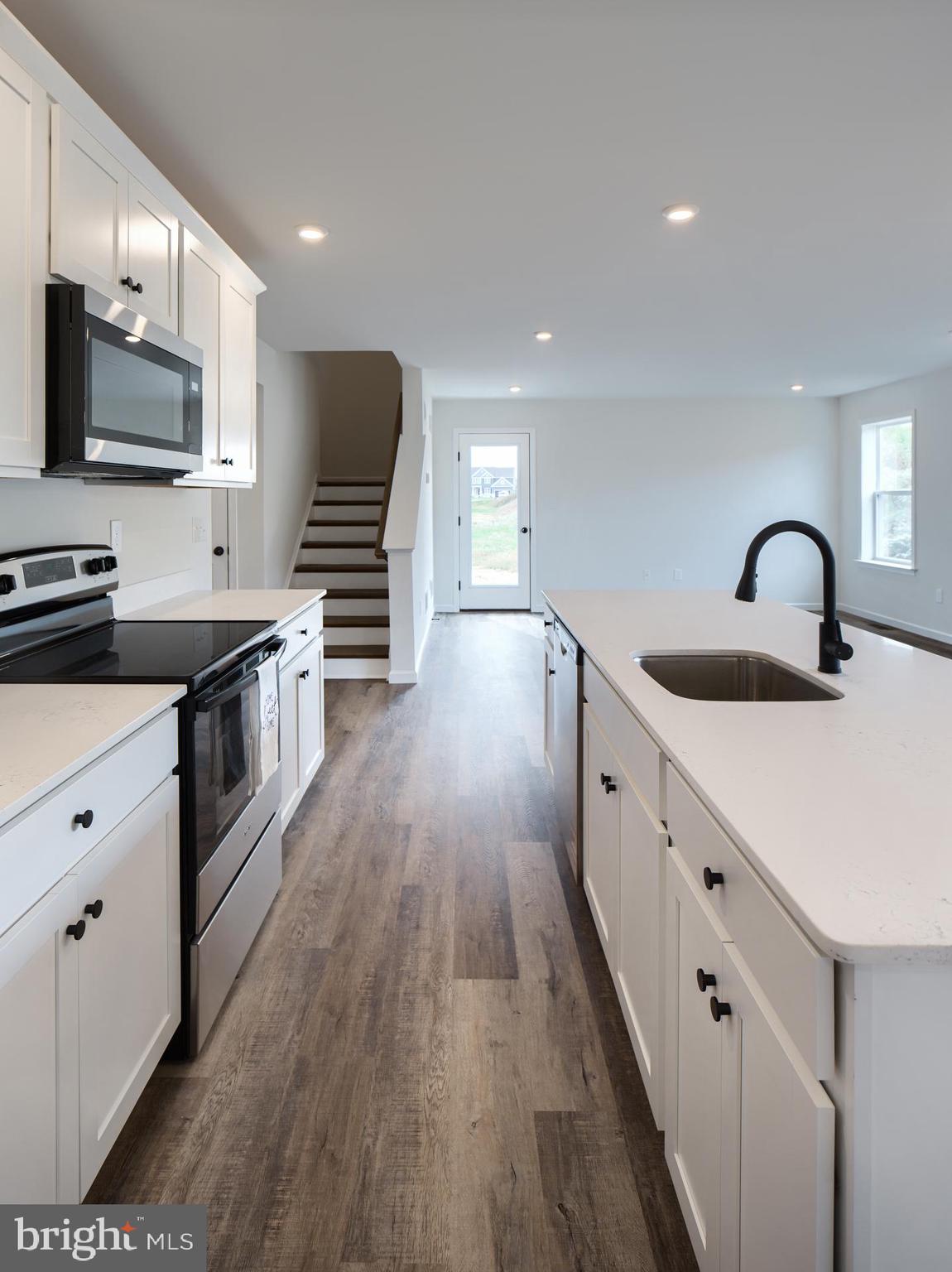 307 Boxwood Drive Windsor, PA 17366 - Photo 15 of 43 a kitchen with granite countertop a sink and steel appliances