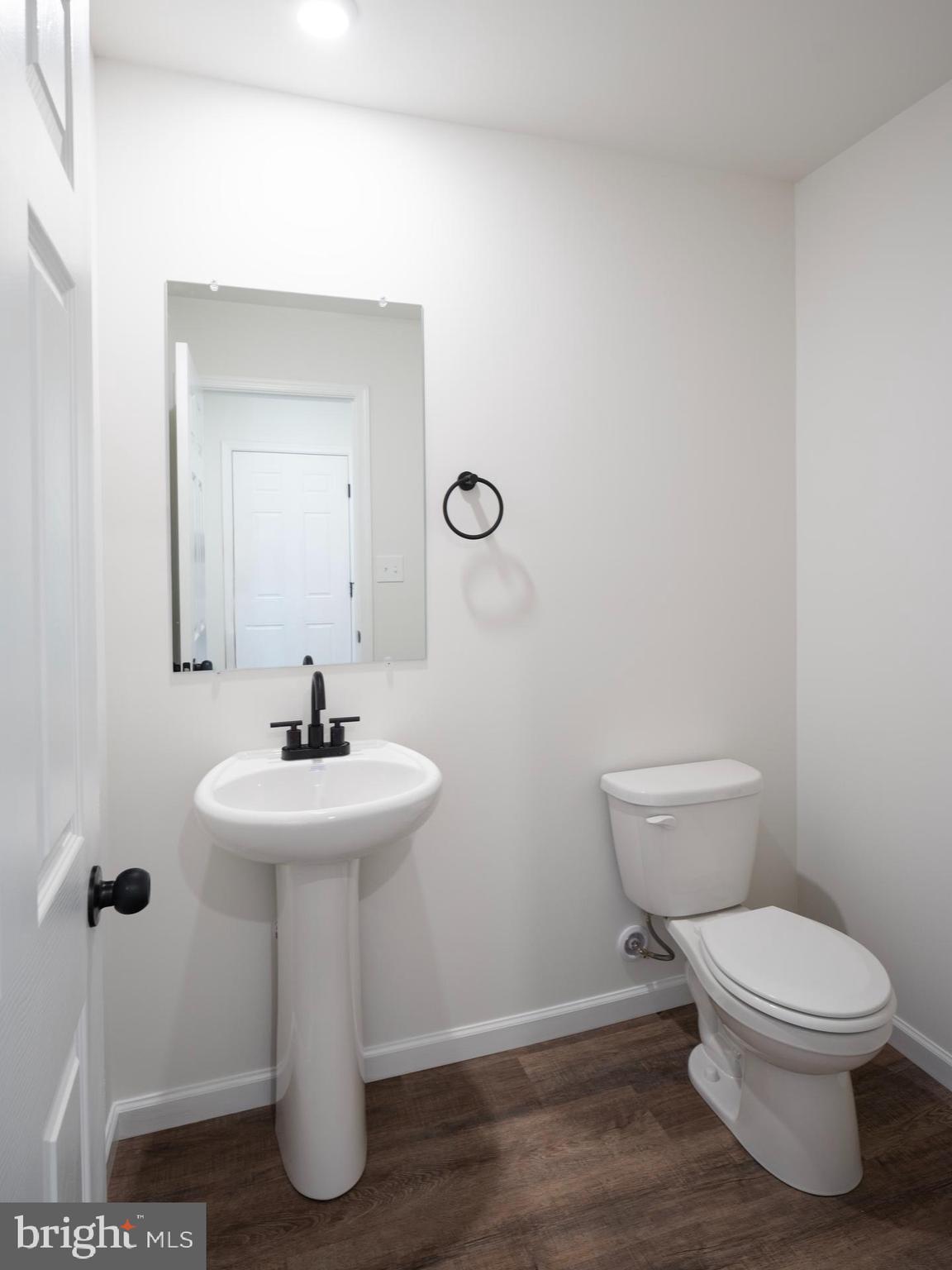 307 Boxwood Drive Windsor, PA 17366 - Photo 16 of 43 a bathroom with a toilet sink and mirror