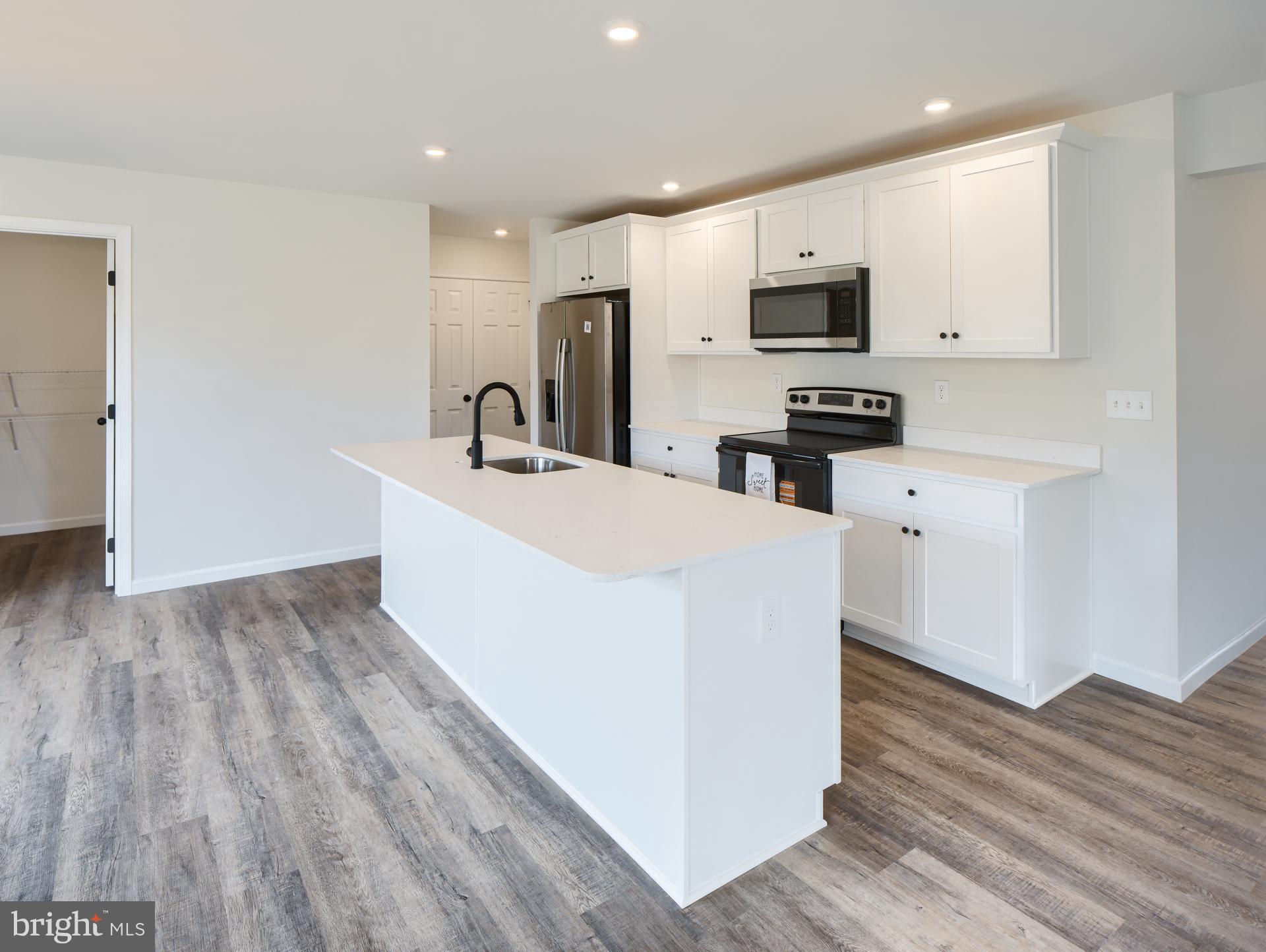307 Boxwood Drive Windsor, PA 17366 - Photo 2 of 43 a kitchen with stainless steel appliances a refrigerator sink and microwave