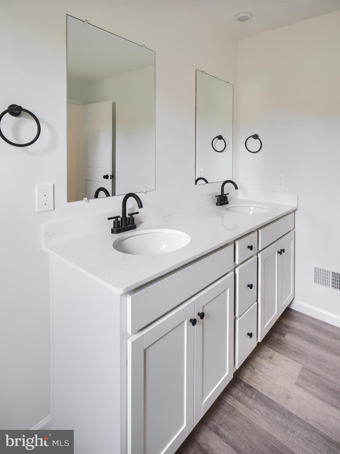 307 Boxwood Drive Windsor, PA 17366 - Photo 24 of 43 a bathroom with a double vanity sink and a mirror
