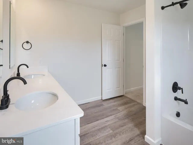a bathroom with a sink and a tub