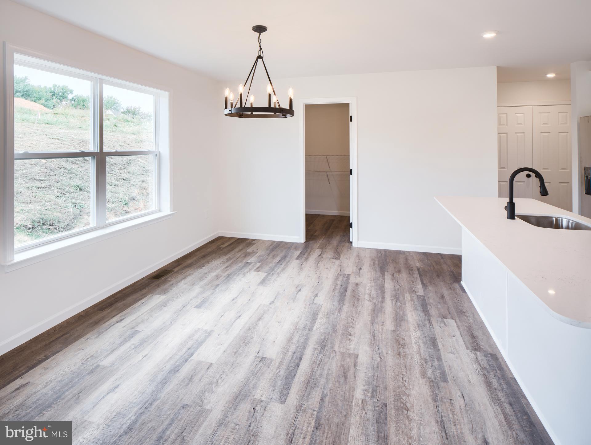 307 Boxwood Drive Windsor, PA 17366 - Photo 3 of 43 a view of empty room with wooden floor and fan