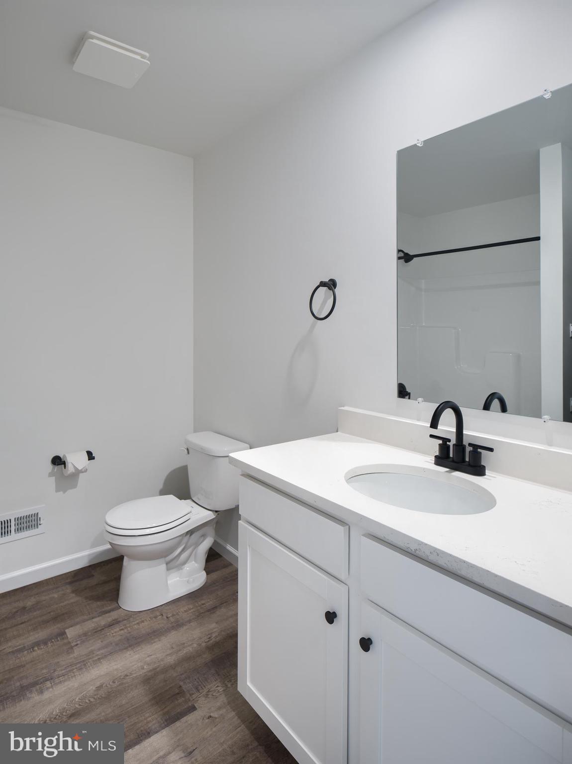 307 Boxwood Drive Windsor, PA 17366 - Photo 33 of 43 a bathroom with a sink a toilet and a mirror