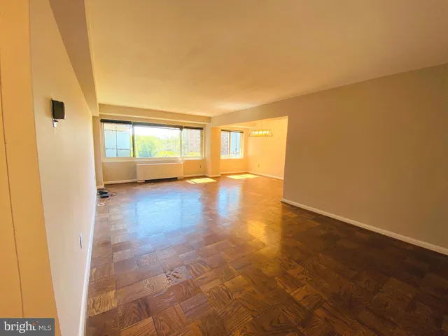 a view of hallway with wooden floor