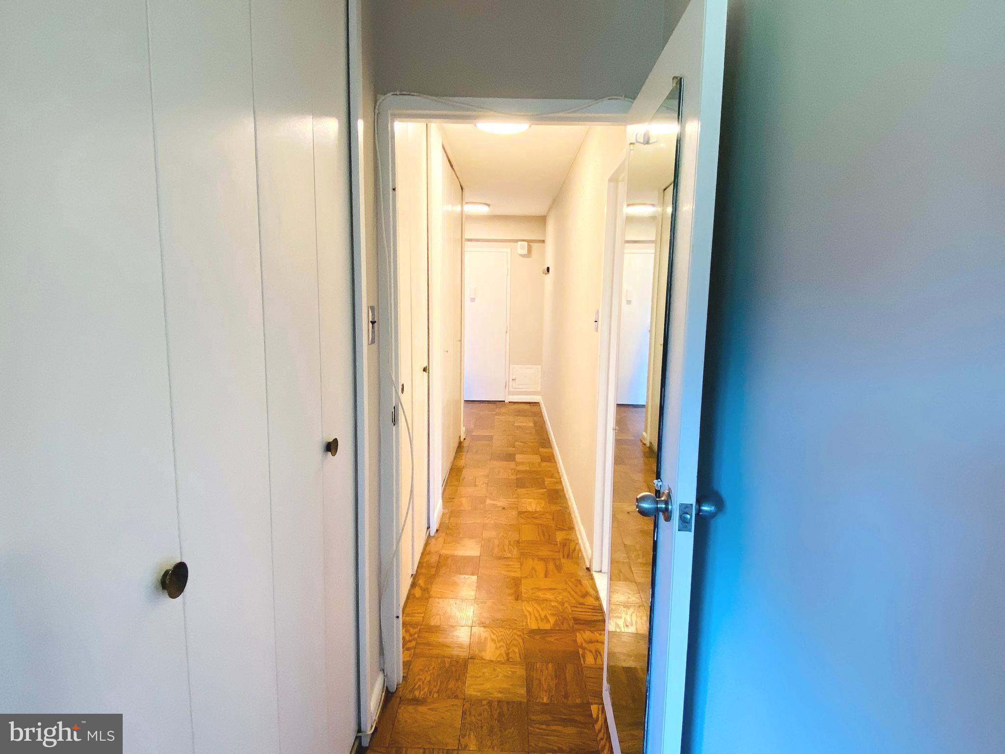 4201 Cathedral Avenue Northwest, Unit 622E Washington, DC 20016 - Photo 20 of 34 a view of a hallway with a glass door