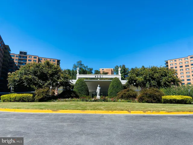 a view of a swimming pool with an outdoor space and seating area