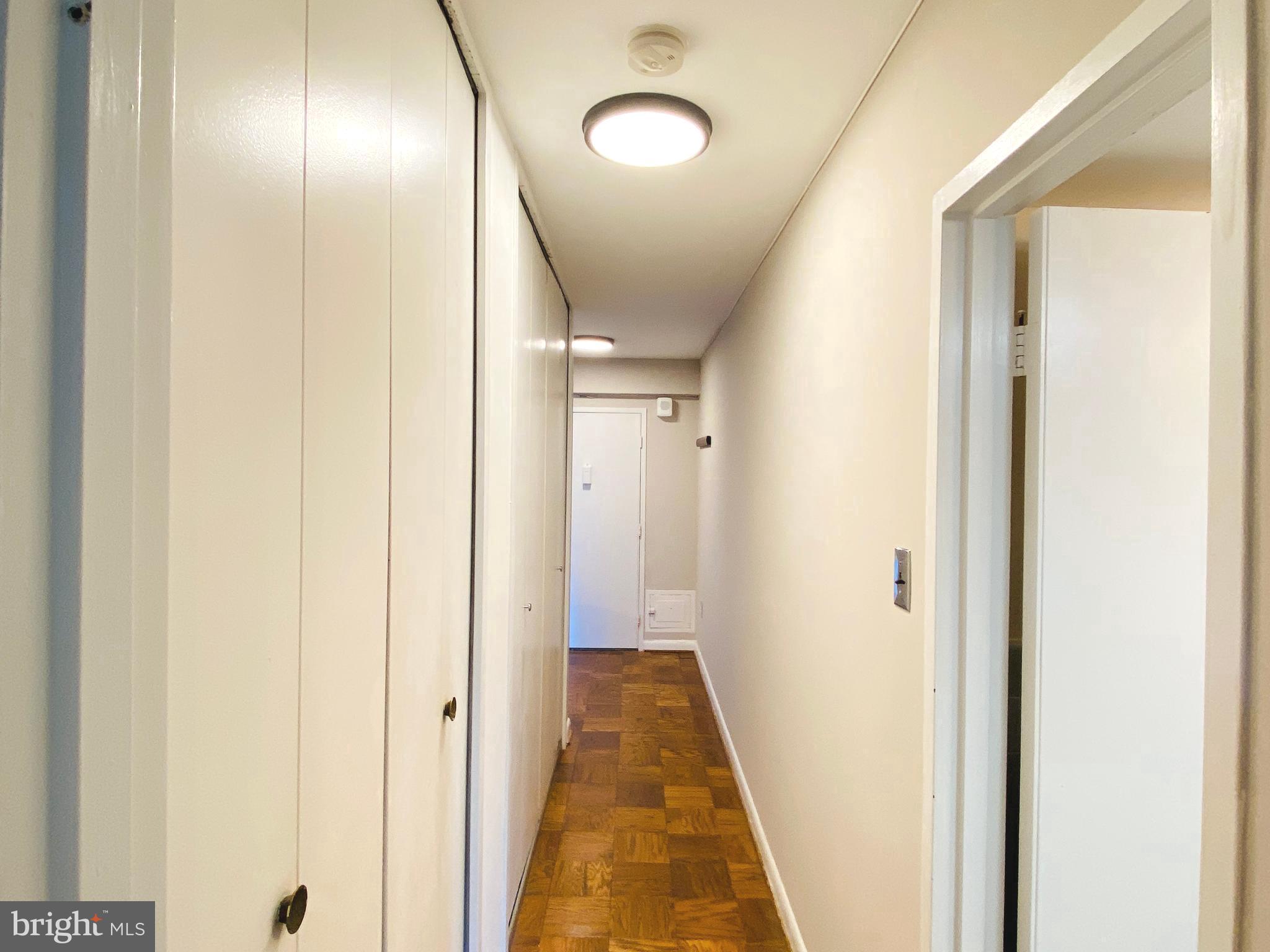 4201 Cathedral Avenue Northwest, Unit 622E Washington, DC 20016 - Photo 21 of 34 a view of hallway with wooden floor