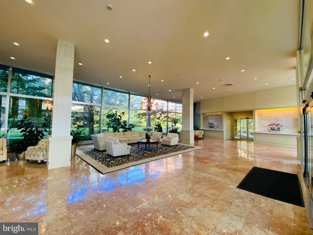 a living room with couch and a large window
