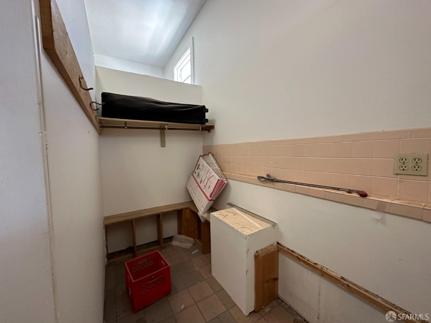 3572 20th Street San Francisco, CA 94110 - Photo 12 of 17 a view of storage and utility room with washer and dryer