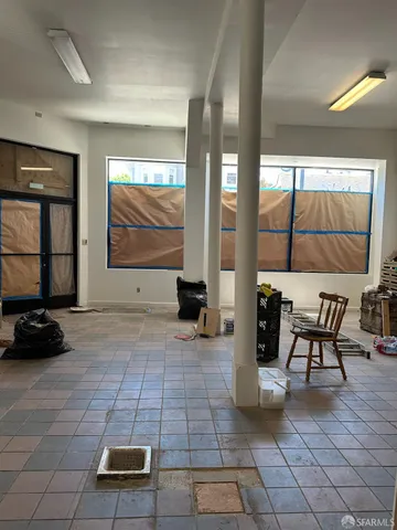 a view of a lobby with furniture and floor to ceiling window