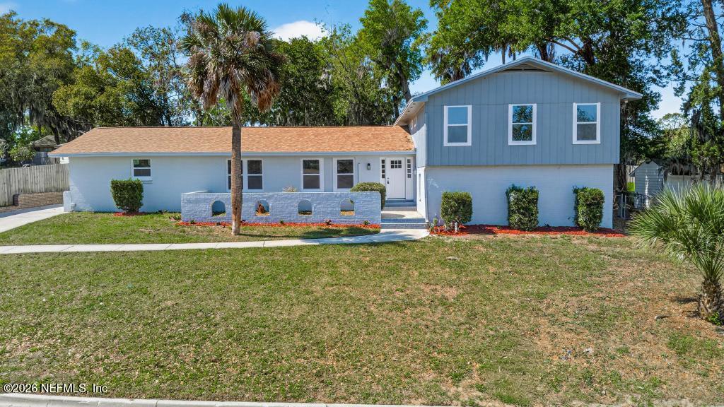 4040 Cove St Johns Road Jacksonville, FL 32277 - Photo 1 of 101 a front view of house with yard and trees