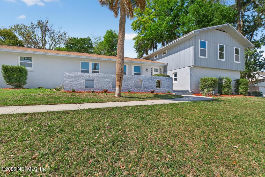 4040 Cove St Johns Road Jacksonville, FL 32277 - Photo 12 of 101 a front view of a house with a yard
