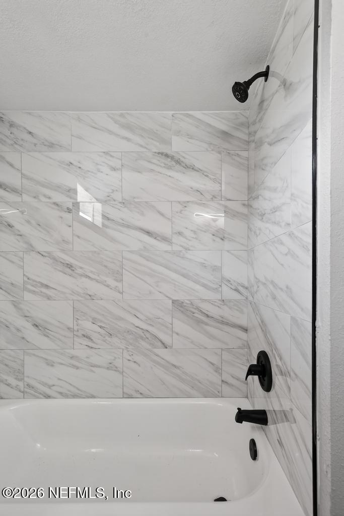 4040 Cove St Johns Road Jacksonville, FL 32277 - Photo 42 of 101 a bathroom with a bathtub