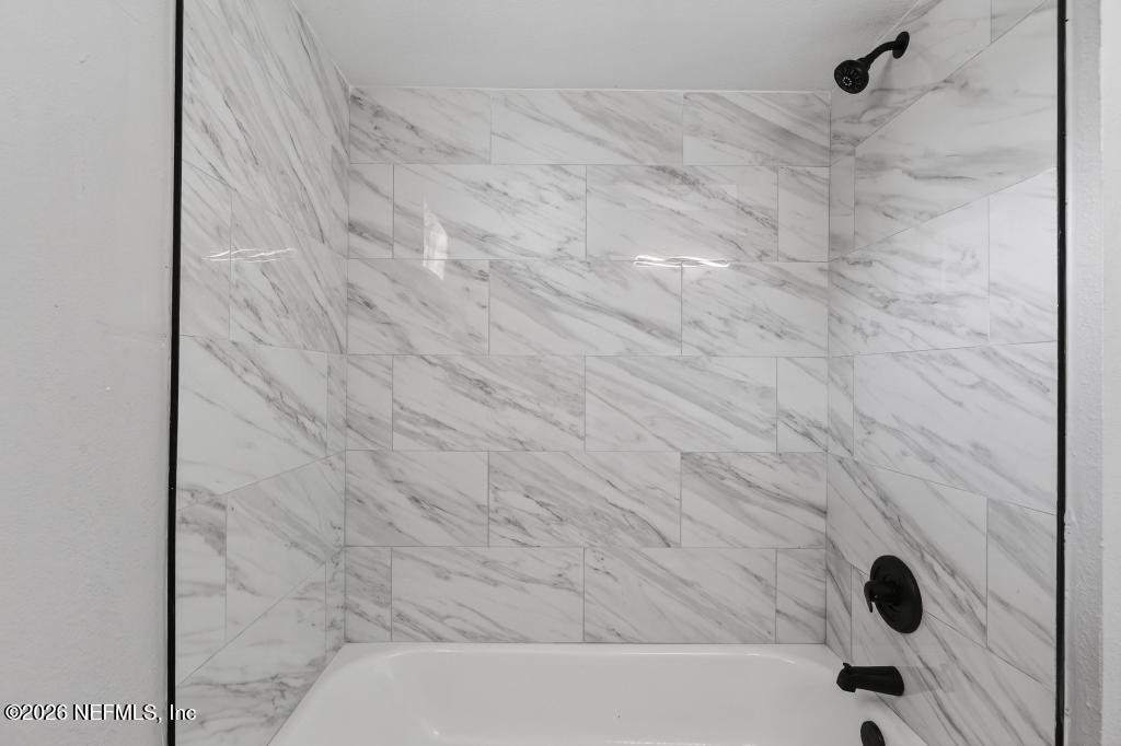 4040 Cove St Johns Road Jacksonville, FL 32277 - Photo 43 of 101 a bathroom with a bathtub