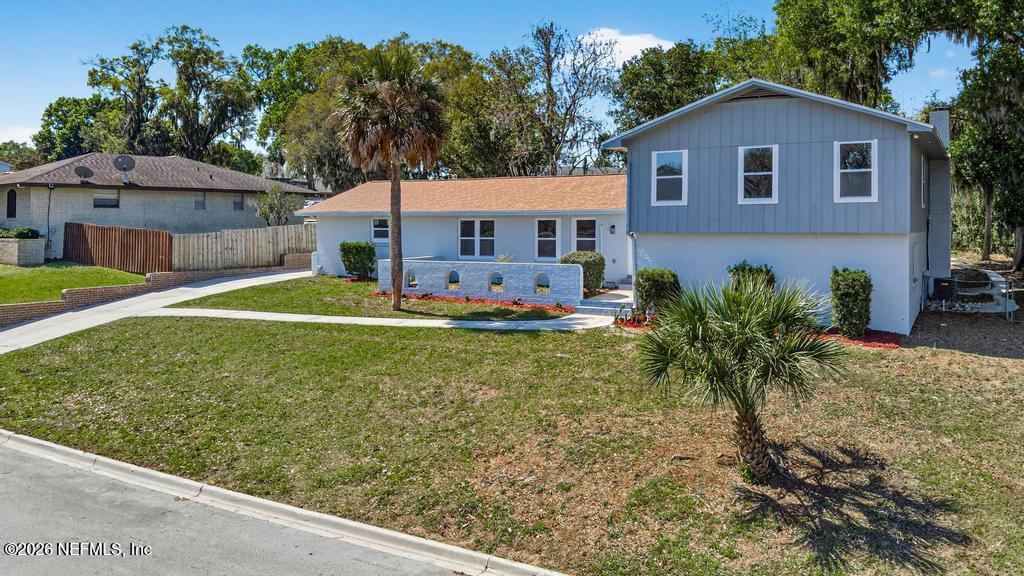 4040 Cove St Johns Road Jacksonville, FL 32277 - Photo 5 of 101 a front view of a house with a yard