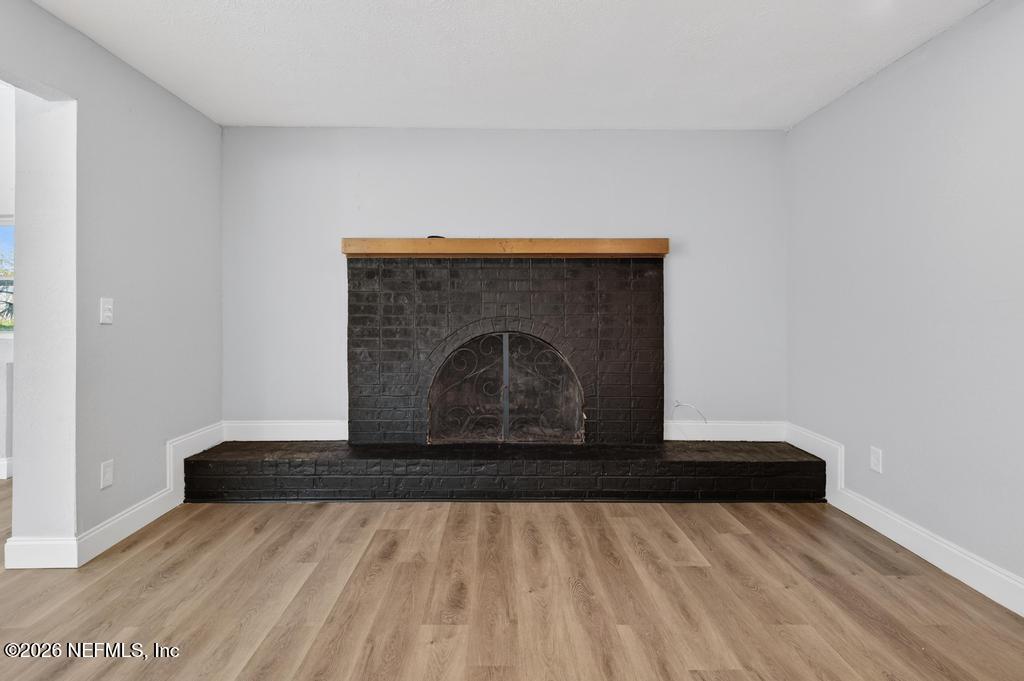 4040 Cove St Johns Road Jacksonville, FL 32277 - Photo 52 of 101 a view of empty room with wooden floor