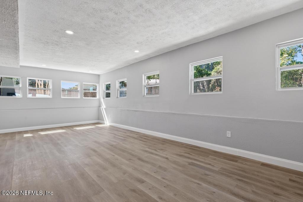 4040 Cove St Johns Road Jacksonville, FL 32277 - Photo 56 of 101 a view of empty room with wooden floor and fan