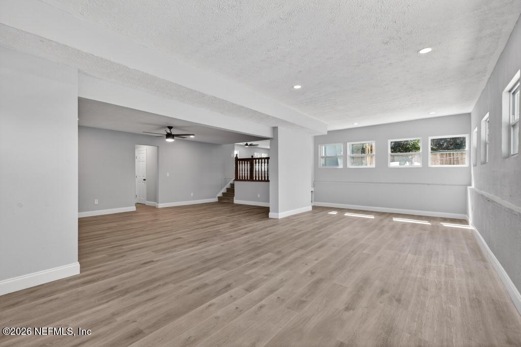 4040 Cove St Johns Road Jacksonville, FL 32277 - Photo 57 of 101 a view of empty room with wooden floor and fan