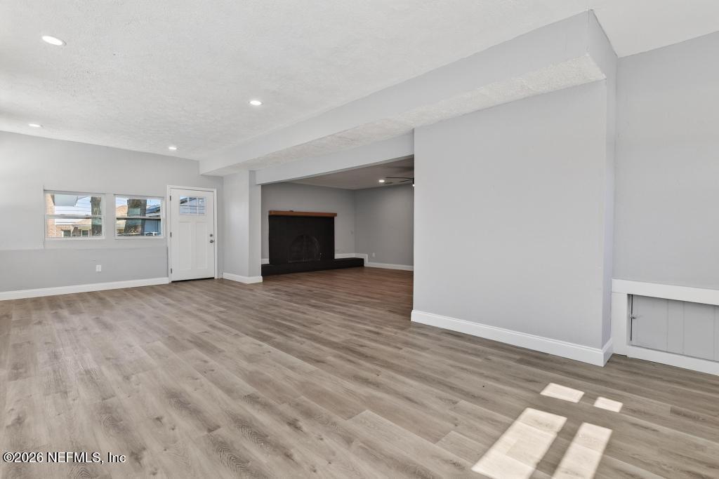 4040 Cove St Johns Road Jacksonville, FL 32277 - Photo 58 of 101 a view of empty room with wooden floor and fan