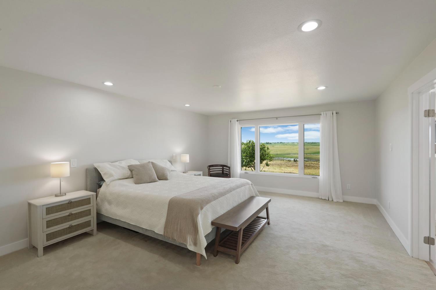 2650 West Twitchell Island Road Rio Vista, CA 94571 - Photo 19 of 60 a bedroom with a bed and a window