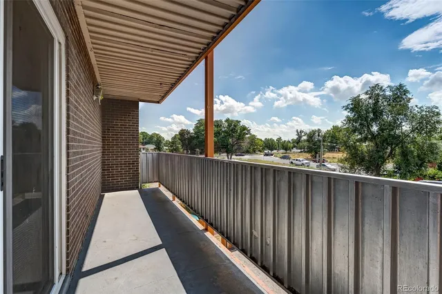 a balcony with wooden floor