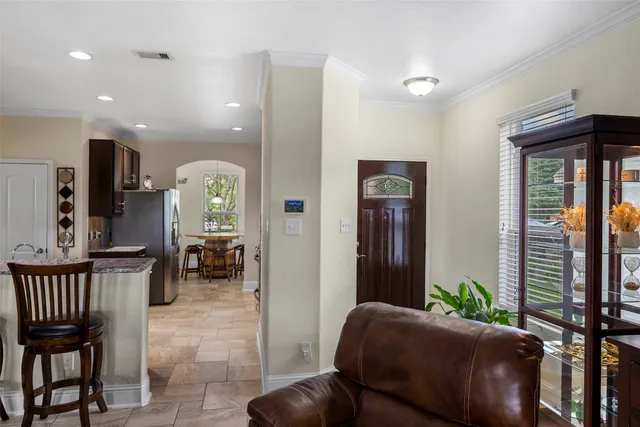 a bathroom with a granite countertop sink a shower and a mirror