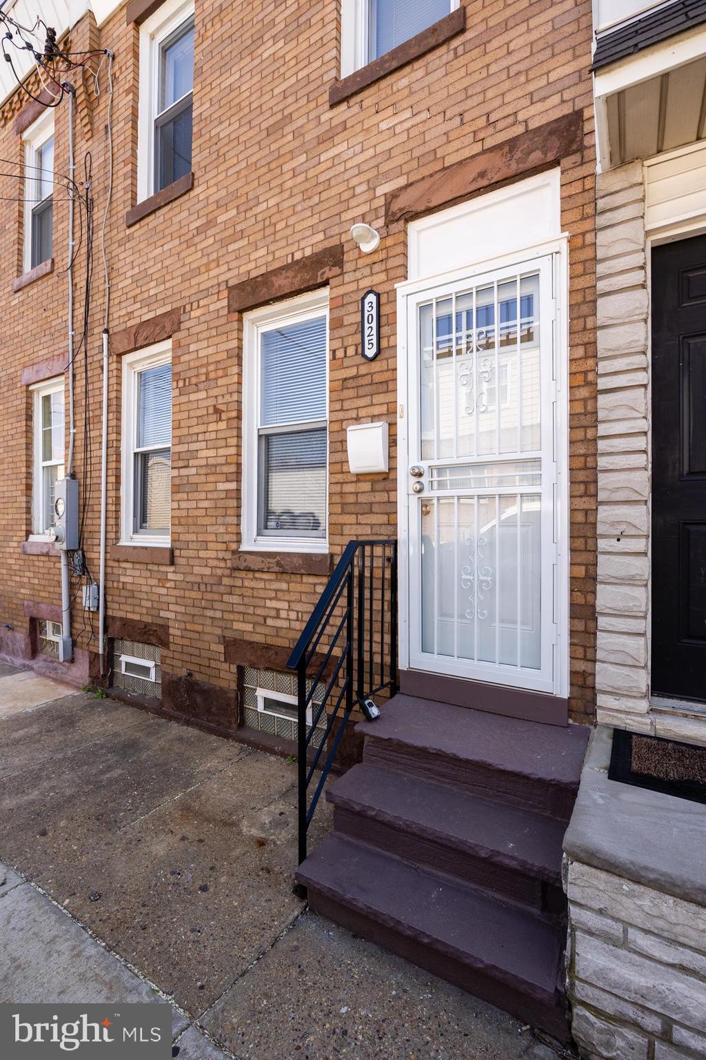 3025 Janney Street Philadelphia, PA 19134 - Photo 2 of 24 a wooden bench sitting in front of a building