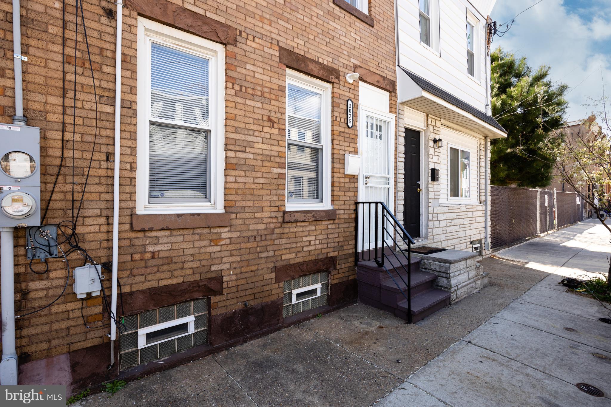 3025 Janney Street Philadelphia, PA 19134 - Photo 21 of 24 a view of a house with a barbeque and wooden fence