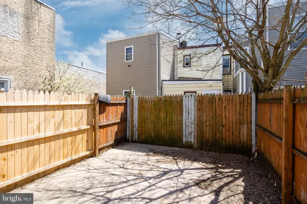 a view of a backyard of the house