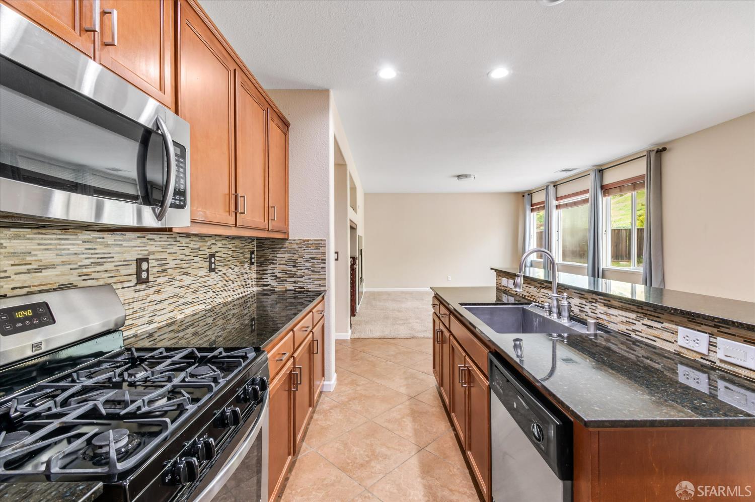 3642 Mallard Way Antioch, CA 94509 - Photo 15 of 45 a kitchen with stainless steel appliances granite countertop a sink stove and cabinets
