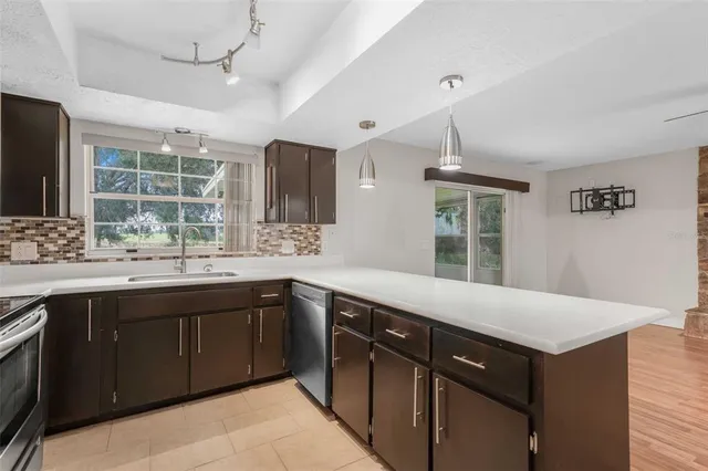 an empty room with a ceiling fan and window