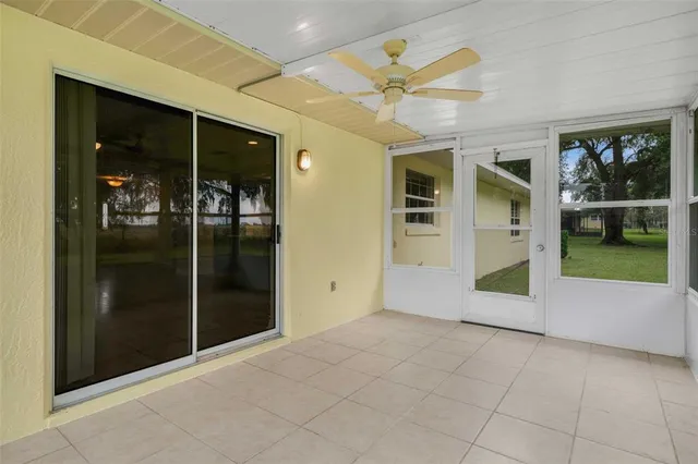 an aerial view of a house with garden space and street view