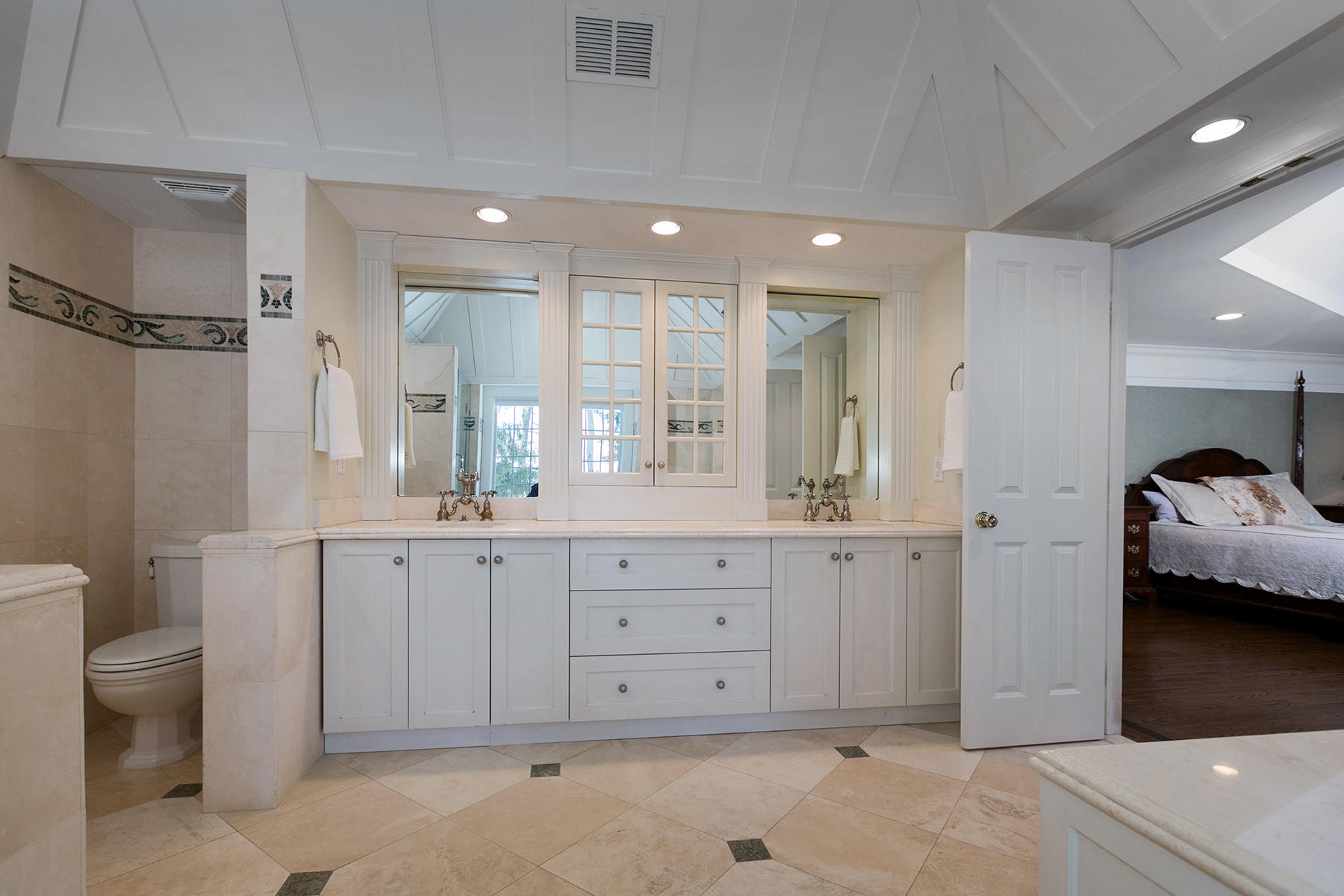 48 Old Farm Road Darien, CT 06820 - Photo 24 of 36 a spacious bathroom with a granite countertop sink a toilet a mirror and shower
