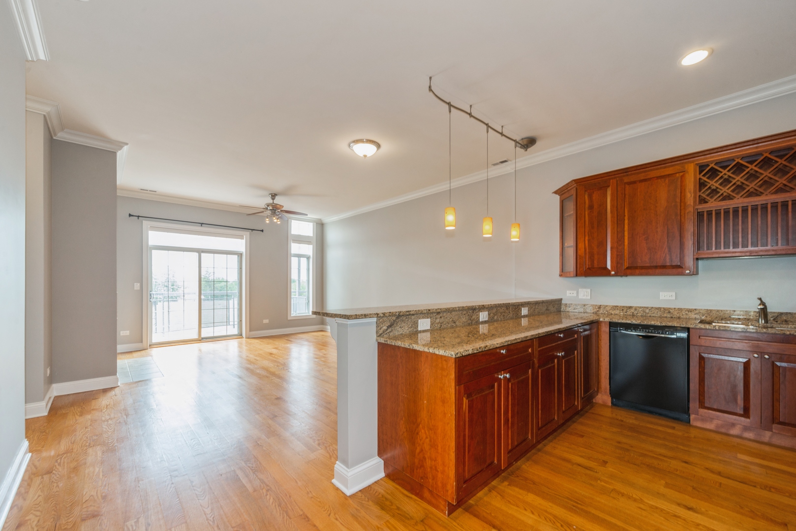 7742 West Higgins Road, Unit 301 Chicago, IL 60631 - Photo 2 of 14 a kitchen with stainless steel appliances granite countertop a sink stove and wooden cabinets