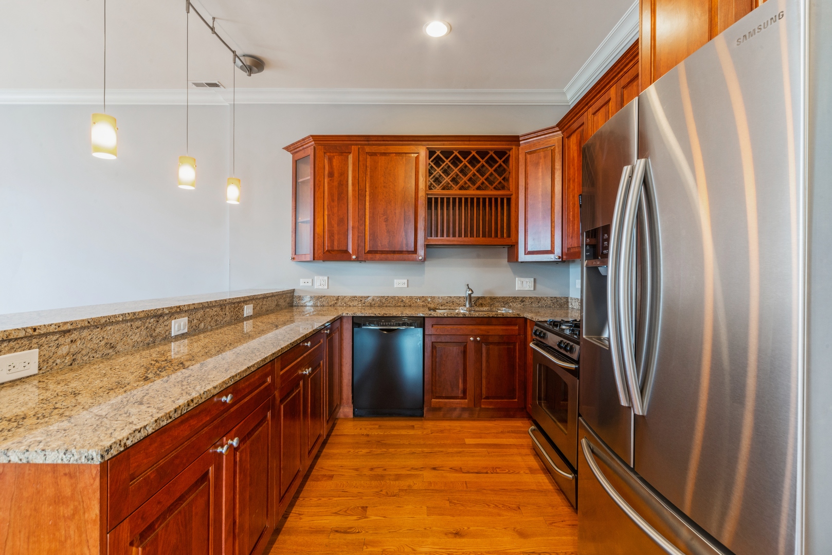 7742 West Higgins Road, Unit 301 Chicago, IL 60631 - Photo 6 of 14 a kitchen with stainless steel appliances granite countertop a refrigerator and a sink