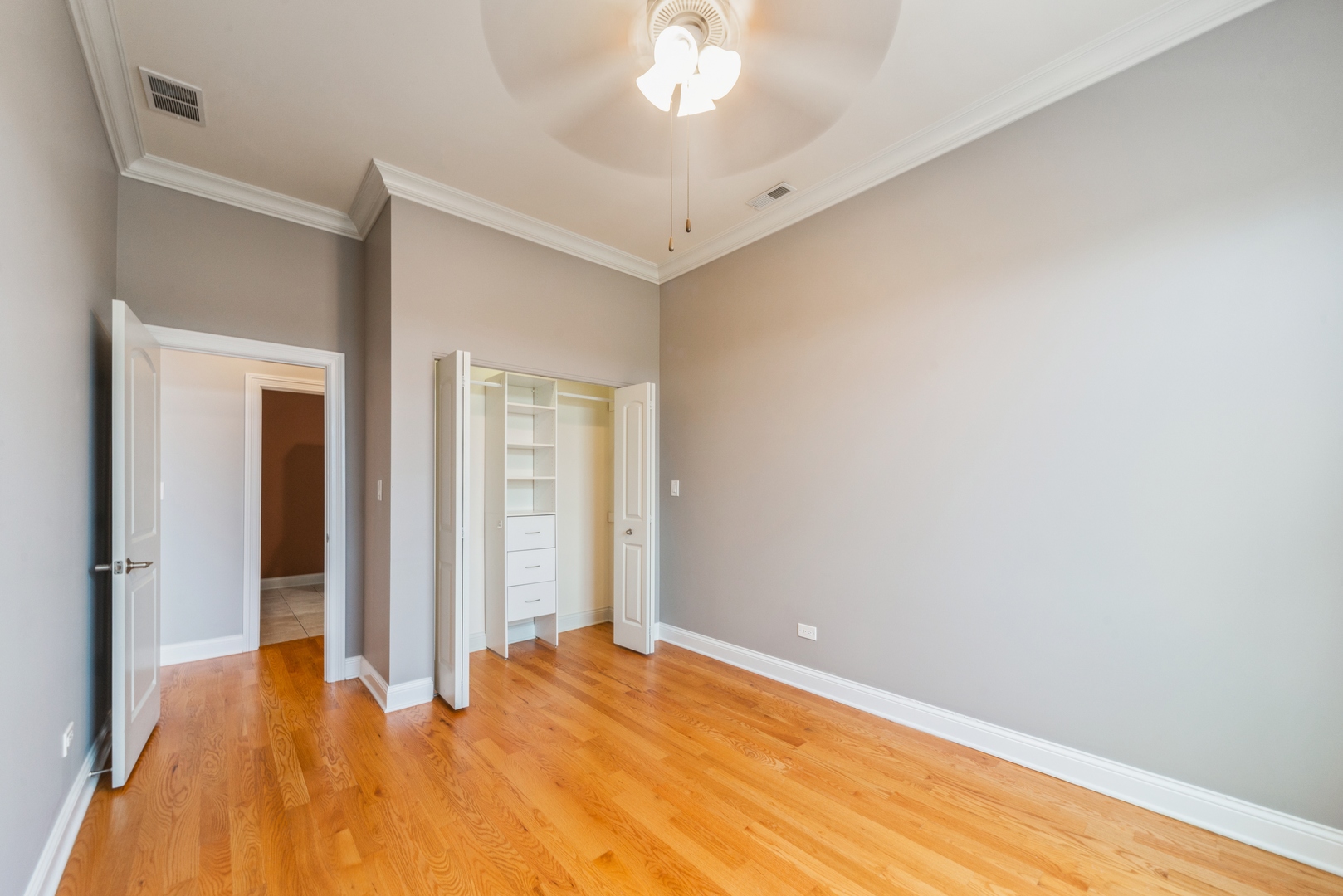 7742 West Higgins Road, Unit 301 Chicago, IL 60631 - Photo 9 of 14 a view of an empty room with a chandelier fan