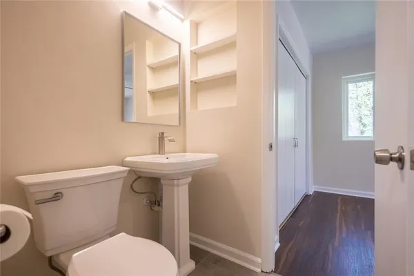 a bathroom with a sink toilet and vanity