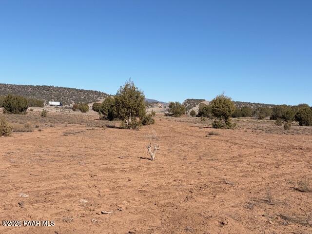 0 Terra Rnch Road Seligman, AZ 86337 - Photo 10 of 22 a view of a dry yard with wooden fence