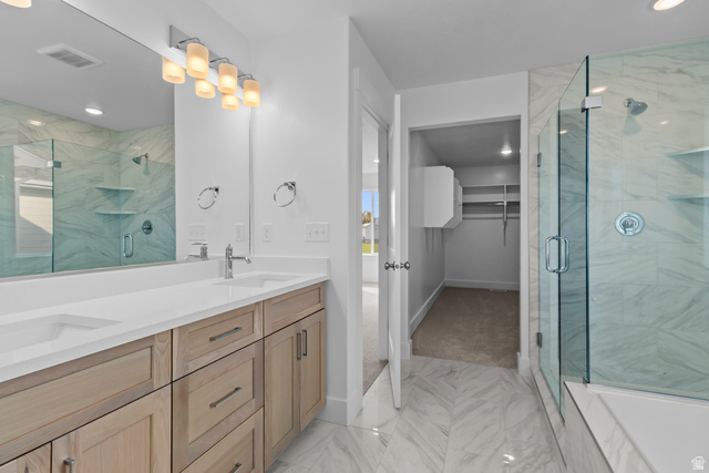 1209 West 500 South, Unit 146 Logan, UT 84321 - Photo 20 of 32 Spa-inspired primary bathroom showcasing a dual-sink vanity with warm wood cabinetry, white quartz countertop, and polished chrome fixtures
