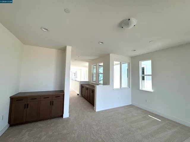 a living room with furniture and window