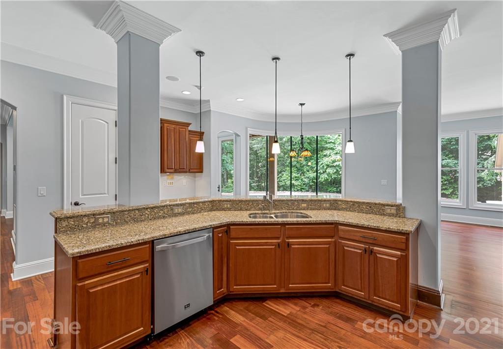 2 Ashbrook Meadows Fletcher, NC 28732 - Photo 15 of 48 a kitchen with a sink stove and cabinets
