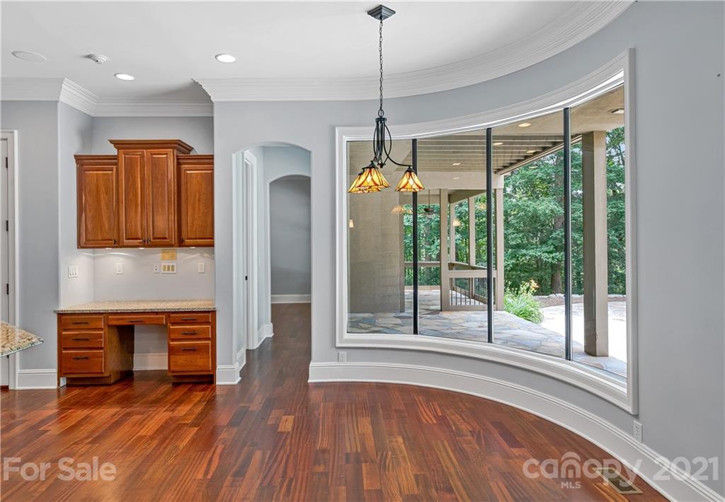 2 Ashbrook Meadows Fletcher, NC 28732 - Photo 16 of 48 a view of a livingroom with wooden floor fireplace and windows