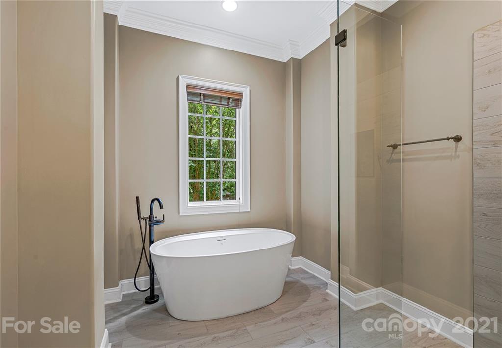 2 Ashbrook Meadows Fletcher, NC 28732 - Photo 20 of 48 a bathroom with a tub and shower