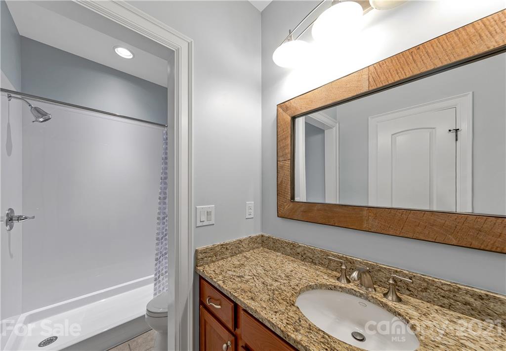 2 Ashbrook Meadows Fletcher, NC 28732 - Photo 29 of 48 a bathroom with a granite countertop sink and a mirror