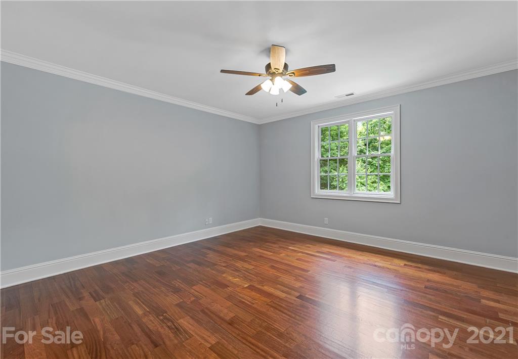 2 Ashbrook Meadows Fletcher, NC 28732 - Photo 30 of 48 an empty room with wooden floor fan and windows