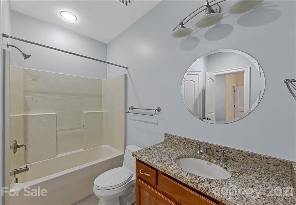 2 Ashbrook Meadows Fletcher, NC 28732 - Photo 33 of 48 a bathroom with a granite countertop sink toilet and shower