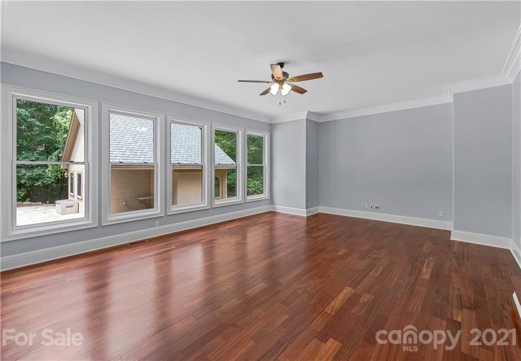 2 Ashbrook Meadows Fletcher, NC 28732 - Photo 5 of 48 a view of an empty room with wooden floor and a window
