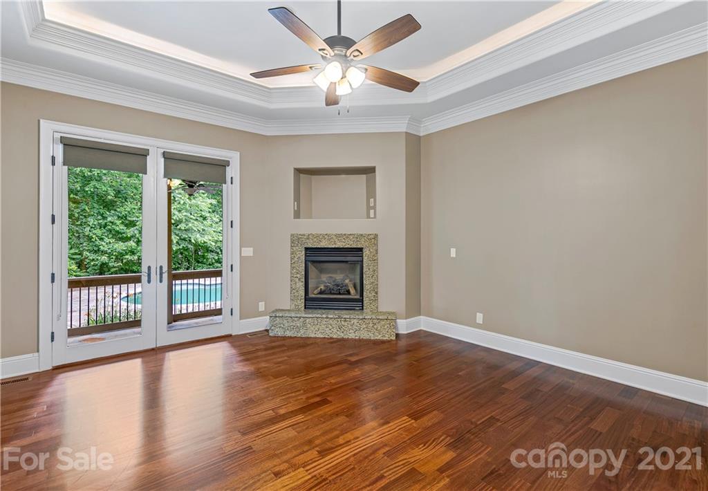 2 Ashbrook Meadows Fletcher, NC 28732 - Photo 6 of 48 a view of an empty room with a window and wooden floor