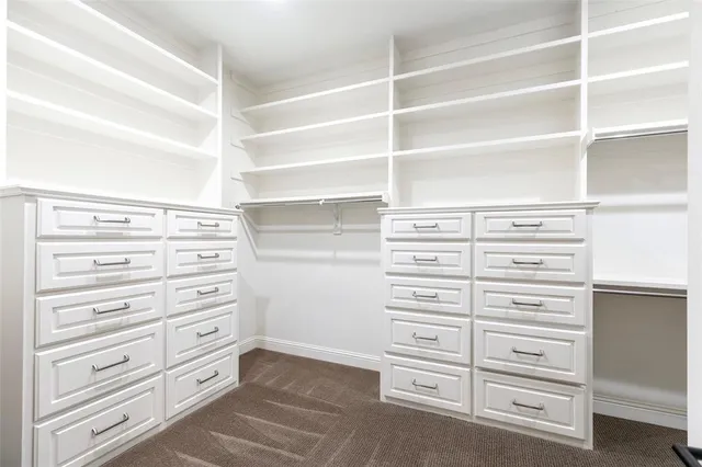 a view of a garden with wooden fence