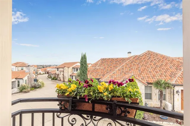 a bathroom with a granite countertop sink a toilet a mirror and shower
